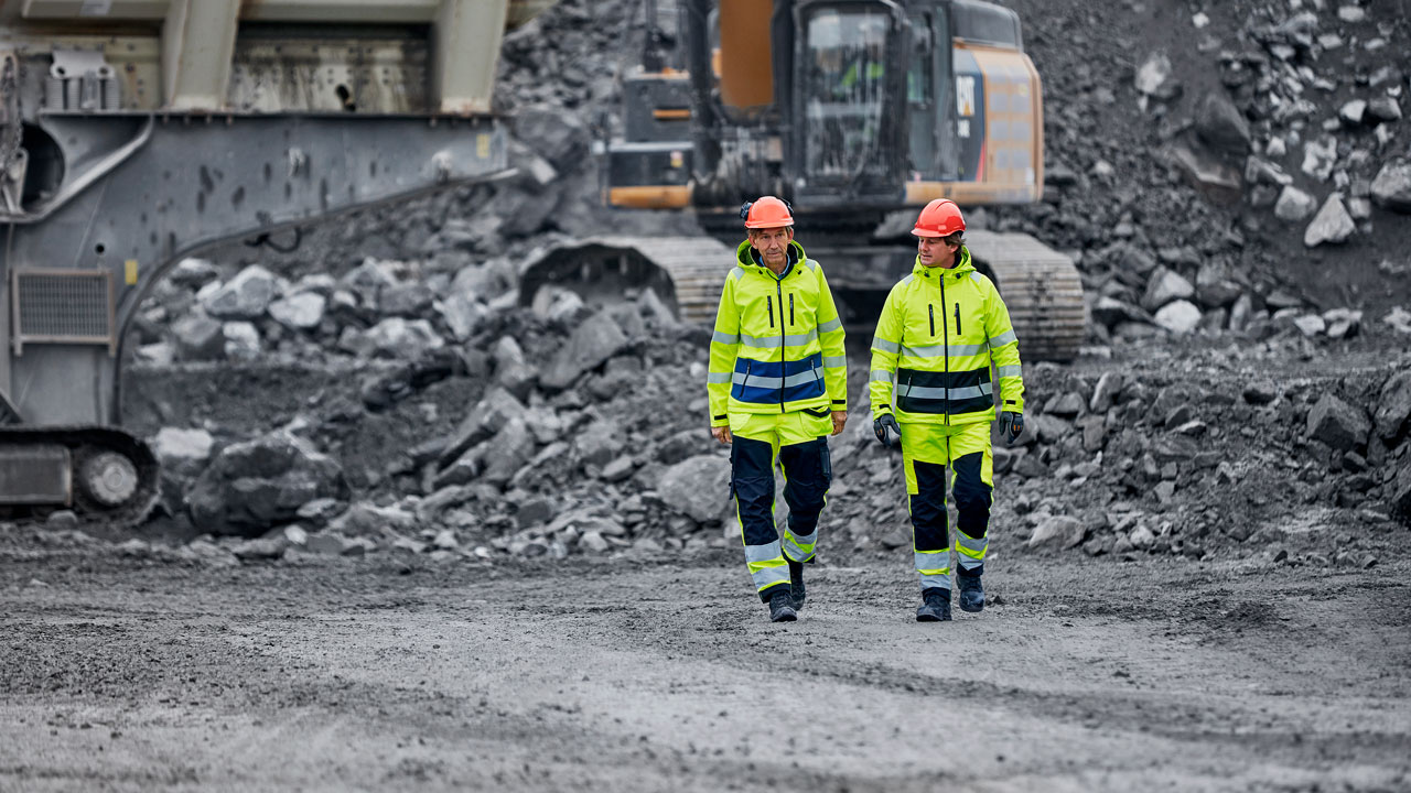 Two persons at a construction yard