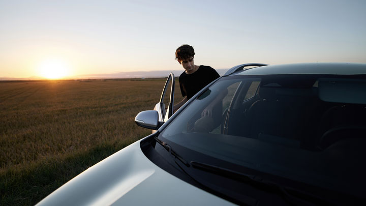 car in front of sunset