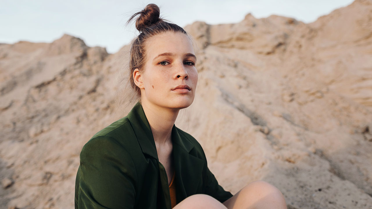 Girl in front of rocks