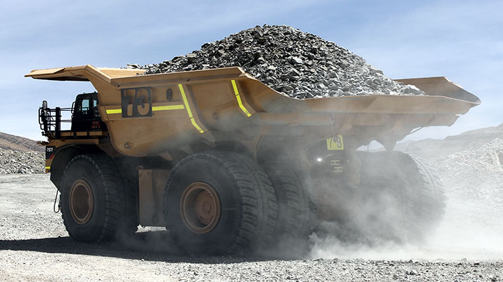A fully loaded dump truck in action