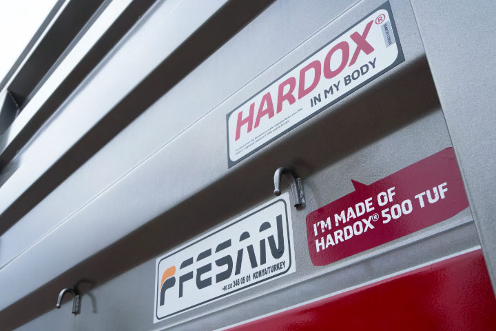 Close-up of a dump trailer with the Hardox® In My Body logo.