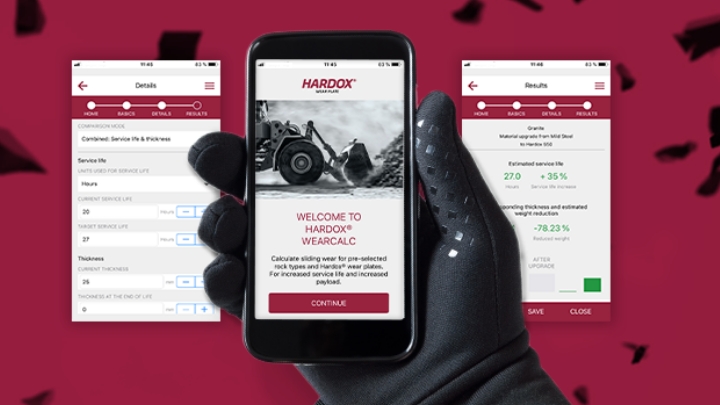 A hand holding the mobile app Hardox® Wearcalc, which calculates wear for different Hardox® steel grades.