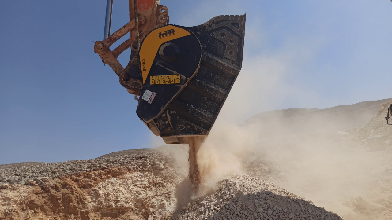 MB Crusher’s BF90.3 crusher bucket in action crushing inert material.