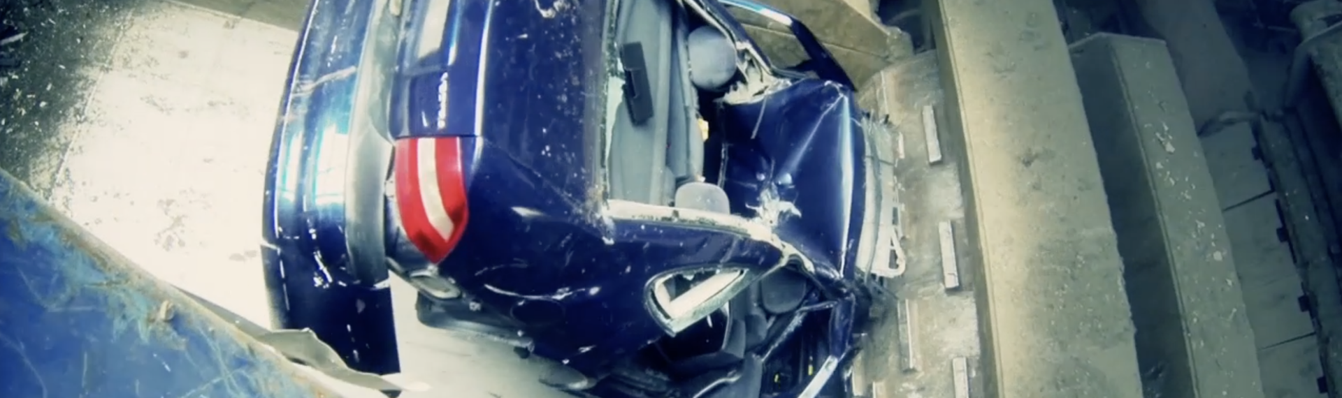 Part of a car being shredded to pieces in an industrial shredder to become valuable scrap.