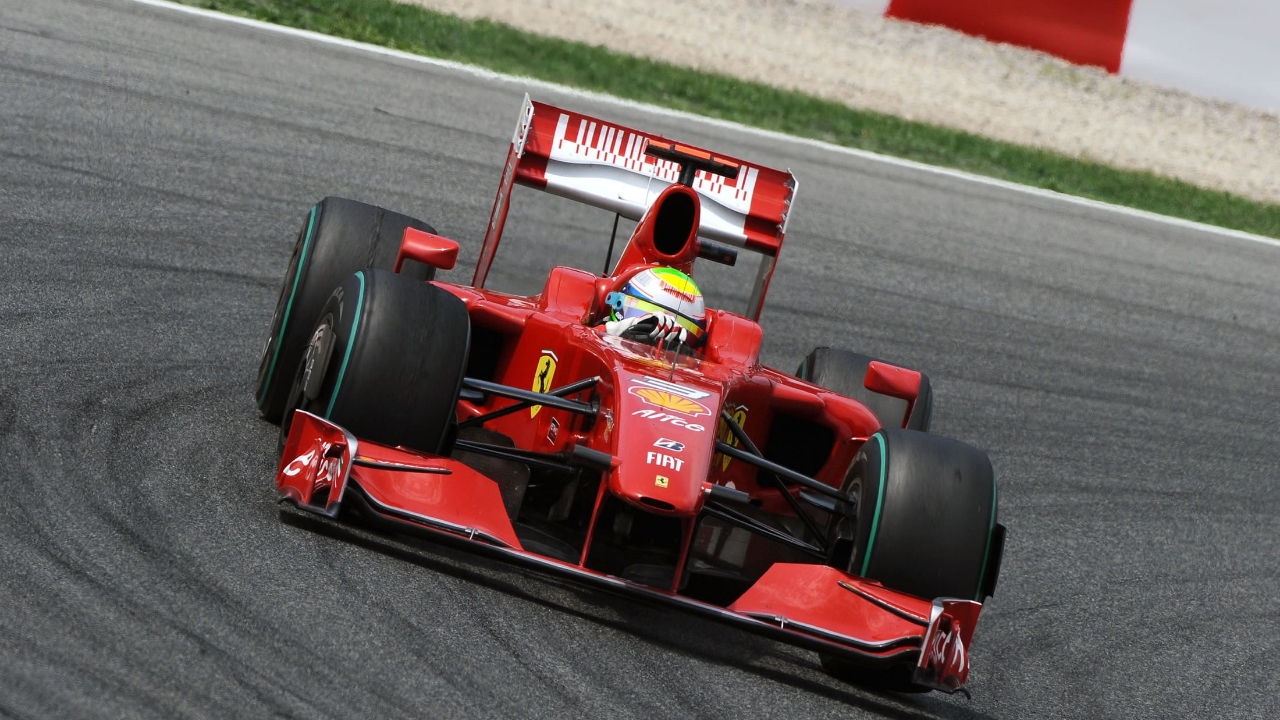 Bright red Formula One racecar with oscillating rollers that use Hardox® wear steel.