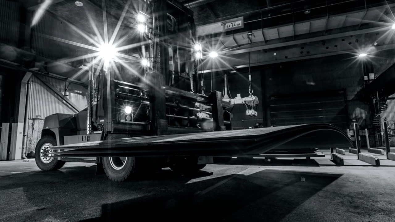 Steel plates of Hardox 400 steel being delivered in a workshop.