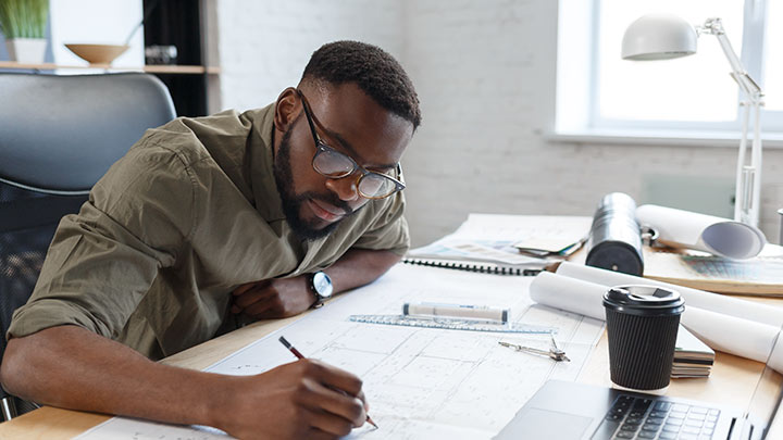 Designer working at desk.