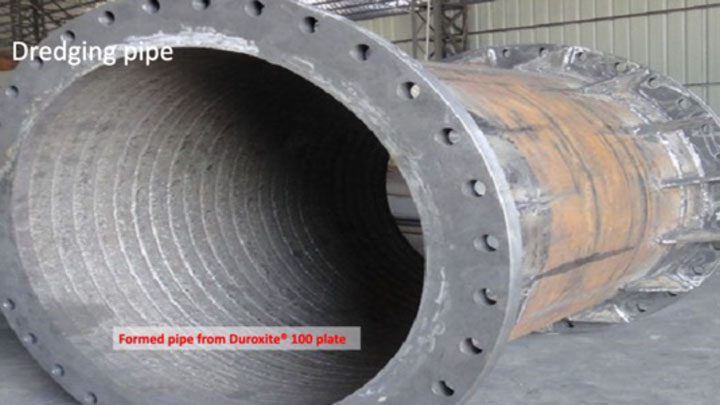 Dredging pipe formed from Duroxite® 100 wear plate.
