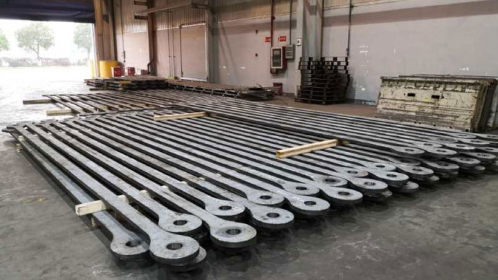 A row of steel tension bars for crawler cranes, made in high-strength Strenx® structural steel.