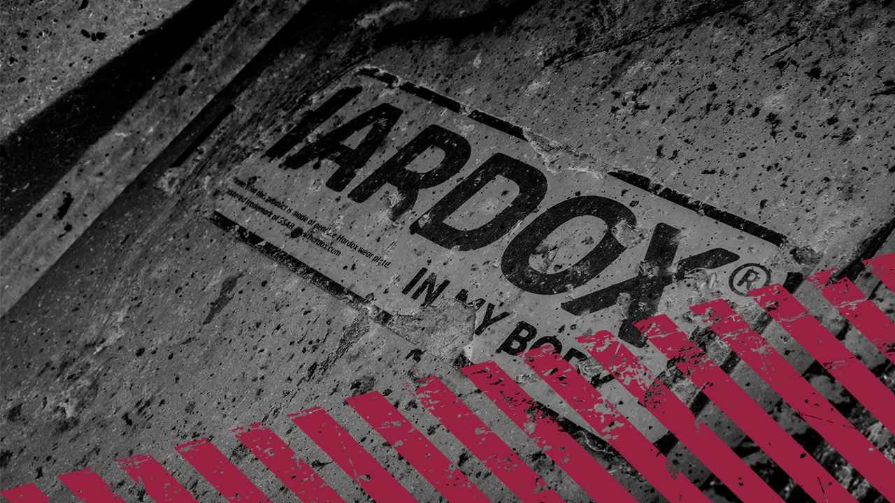 Close-up of the Hardox® In My Body sign on heavy equipment.